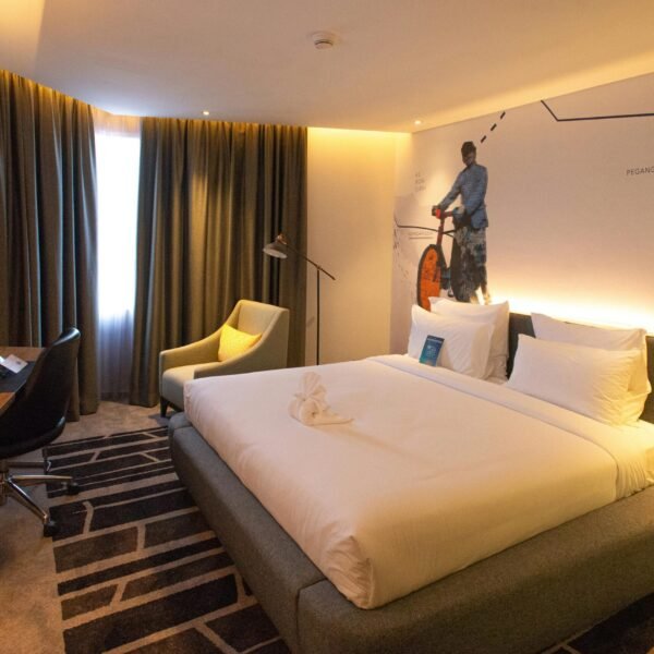 Modern hotel room interior in South Jakarta, offering cozy ambiance with warm lighting and stylish decor.