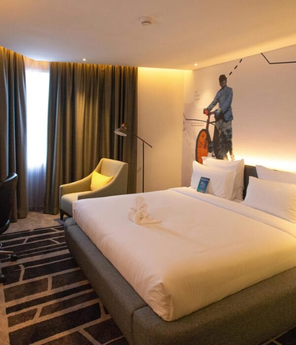 pexels-photo-33125906-33125906 Modern hotel room interior in South Jakarta, offering cozy ambiance with warm lighting and stylish decor.