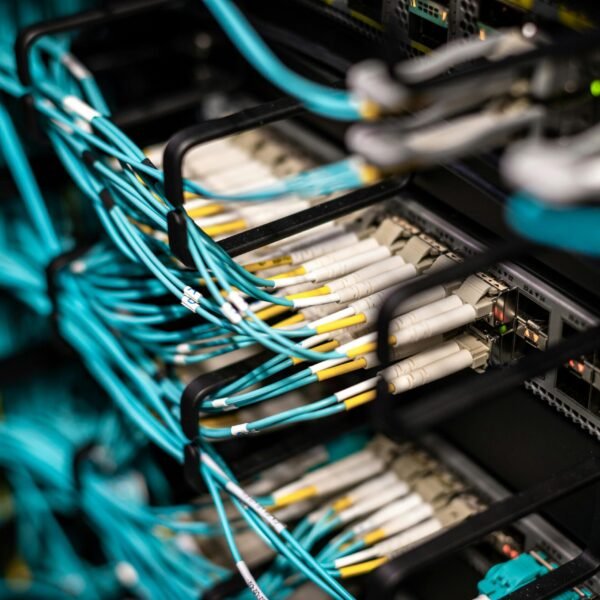 Numerous wires and cables mounted into server patch panel in modern data center