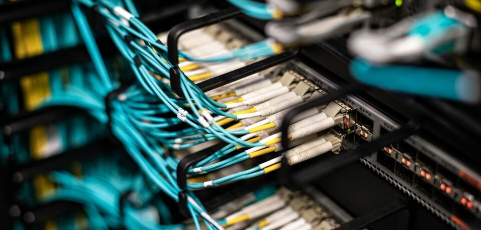 Numerous wires and cables mounted into server patch panel in modern data center